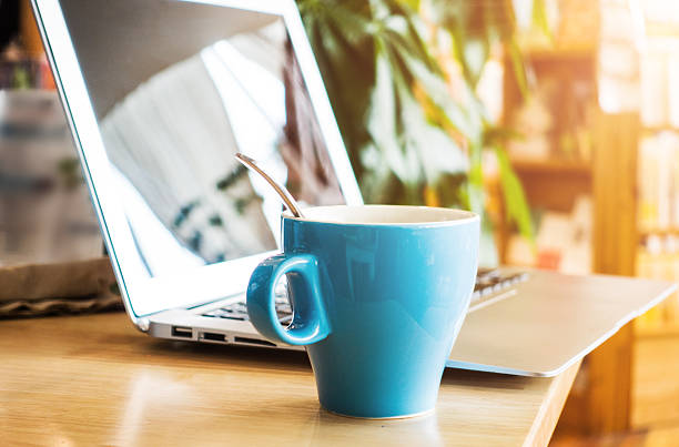 istock Laptop and a cup of coffee on office desk 495799562