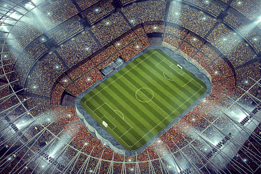 A soccer stadium with goals on a marked green grass pitch in the day time - 3D render