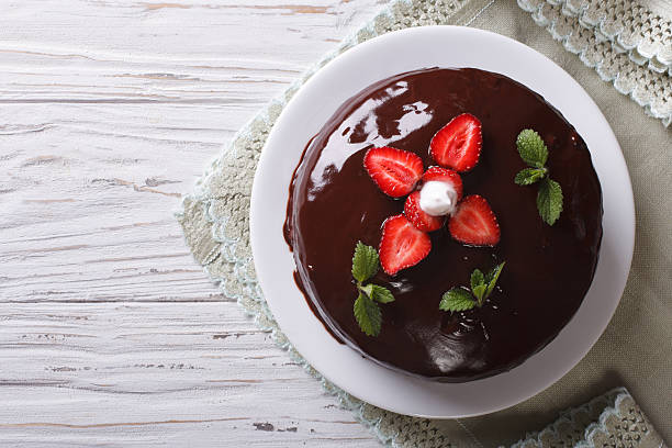Chocolate cake with fresh strawberries. horizontal top view