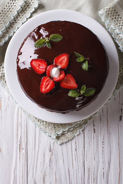 istock chocolate cake with strawberries. vertical top view 495801676