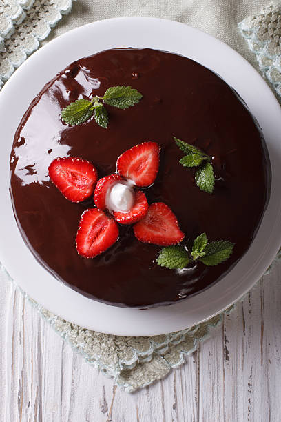 istock chocolate cake with strawberries closeup. vertical top view 495801854