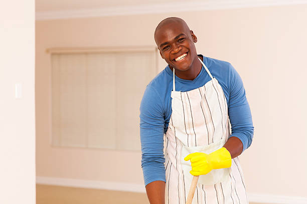 istock african american man cleaning his apartment 495801910