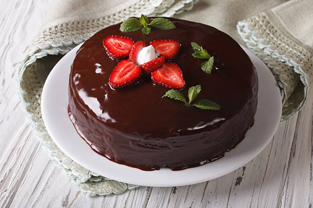 istock Fresh strawberry cake with chocolate topping horizontal close-up 495802072