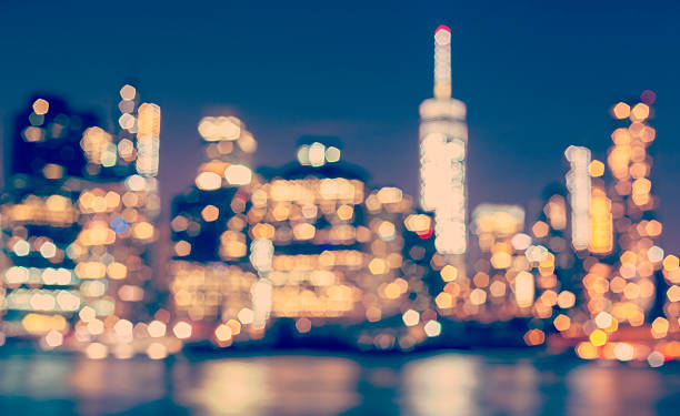 istock Vintage toned blurred Manhattan waterfront at night, NYC, USA. 495802216