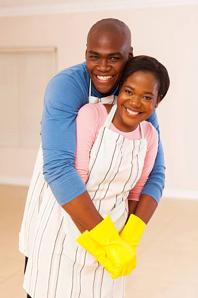 istock young african husband and wife embrracing 495803402