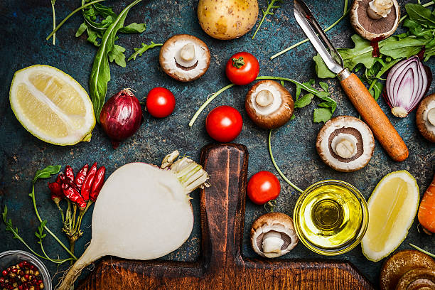 istock Vegetables and ingredients for health cooking on rustic background 495803564