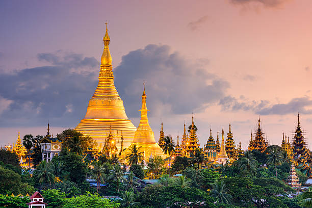 Yangon Myanmar at Shwedagon Pagoda Yangon, Myanmar view of Shwedagon Pagoda at dusk. stupa stock pictures, royalty-free photos & images