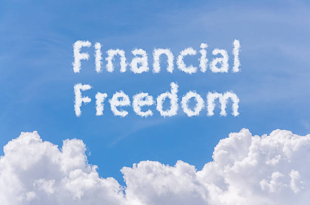 istock financial freedom concept, text cloud on blue sky 495804618