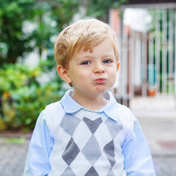 istock Funny happy and smiling kid boy on way to nursery 495806738