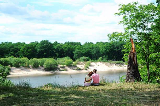 istock the young pair retired at the river 495808734