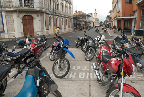 Iquitos, Peru - May 1st, 2010: Motorbike parking on a street of Iquitos, Peru on May 1, 2010.