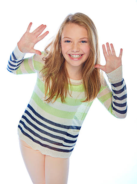 Studio shot of a young girl gesturing against a white backgroundhttp://195.154.178.81/DATA/i_collage/pu/shoots/805884.jpg