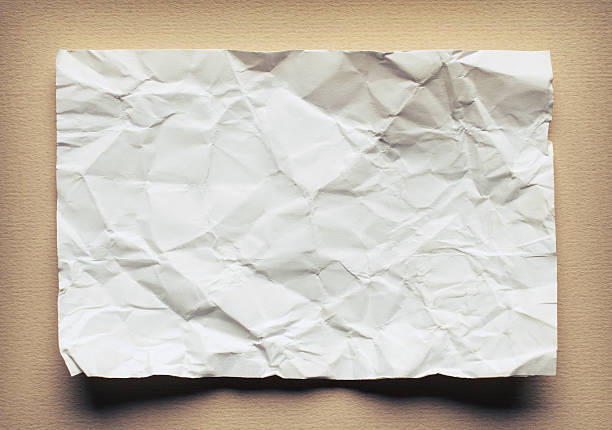 istock Crumpled  white paper card on beige background, place for text 495810752
