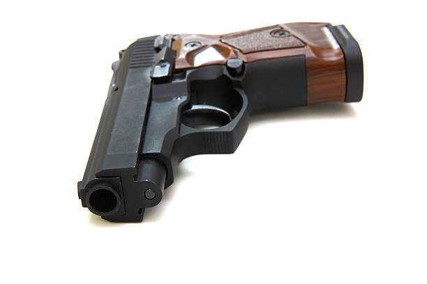 istock pistol  isolated on a white background 495810850