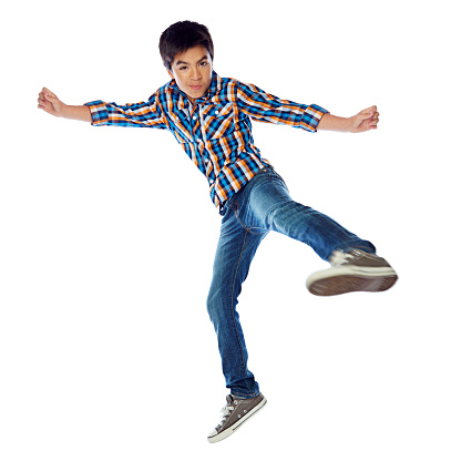 Studio shot of a young boy jumping energetically against a white backgroundhttp://195.154.178.81/DATA/i_collage/pu/shoots/805884.jpg