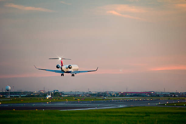 istock passenger plane fly up over take-off runway from airport 495811669