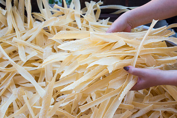 istock Homemade pasta in woman hands 495811684