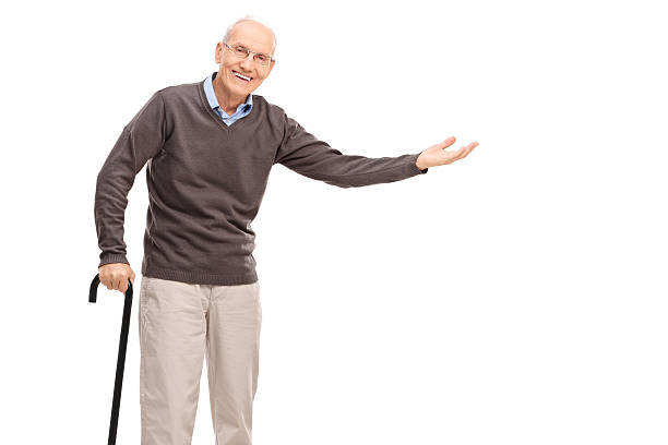 istock Old man with a cane gesturing with his hand 495811758