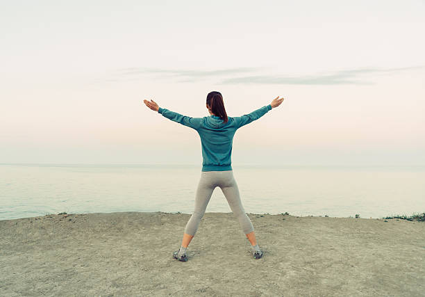 istock Girl workout on coast in the morning 495813070