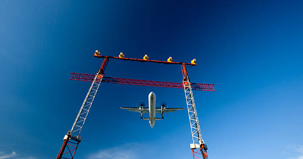 istock passenger plane fly down over take-off runway from airport 495813533