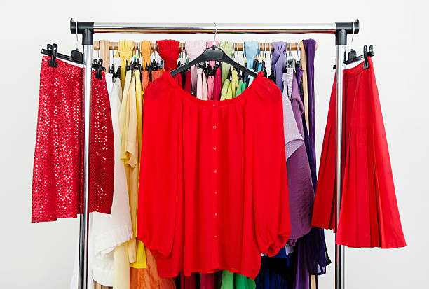 istock Cute red outfits displayed on a rack. 495813543