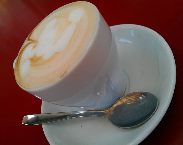 istock Cup of art latte or cappuccino coffee 495816097