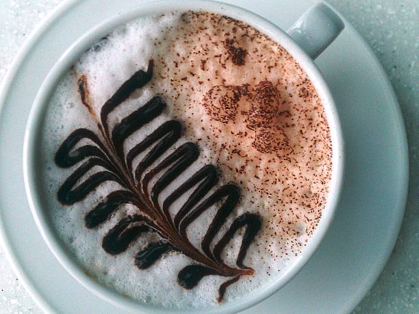 Cup of art latte or cappuccino coffee