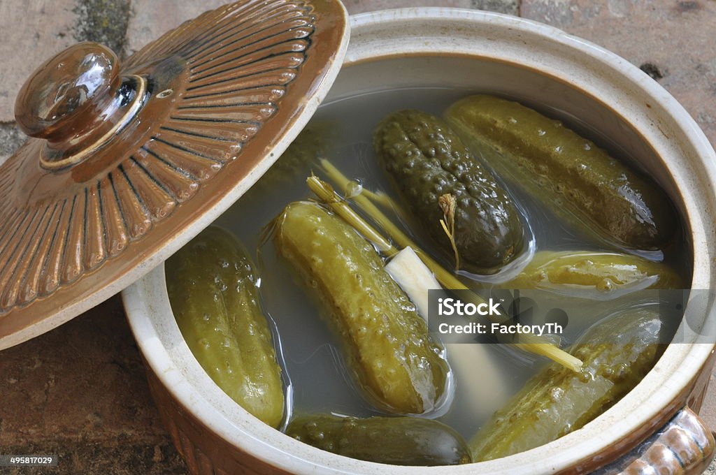 Pickled cucumbers Pickled cucumbers in stone pot Arranging Stock Photo