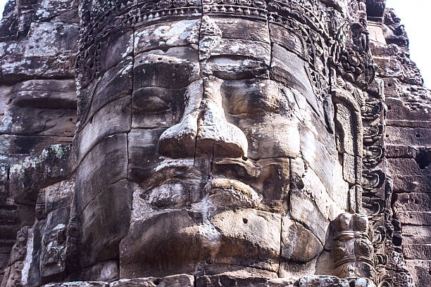 Shot in color detail on the facade of this historic building representing some character, animal or flower. Set at Siem Reap, Angkor Wat , Cambodia, Asia