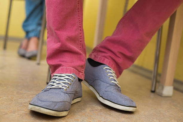 istock Students feet under the desk in classroom 495818137