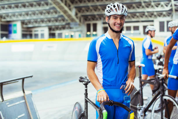 Portrait of track cyclist in velodrome  velodrome stock pictures, royalty-free photos & images