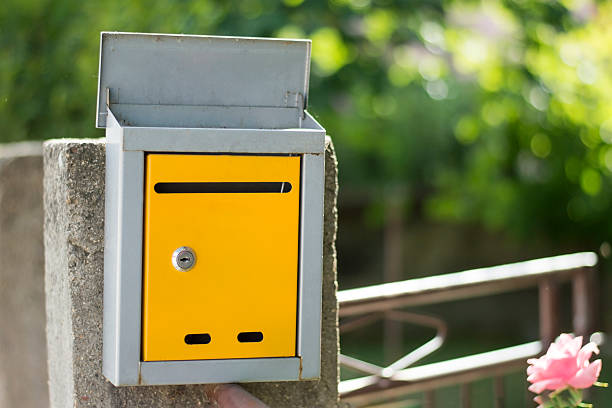 istock Open mailbox on fence shot with low depth of field 495827524