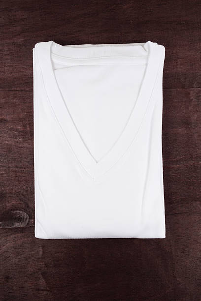 istock white t-shirt on wood background 495828100