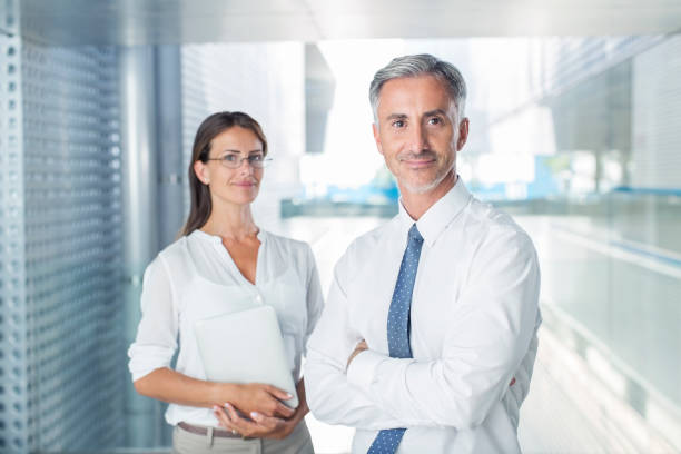 istock Portrait of confident business people in office 495828131