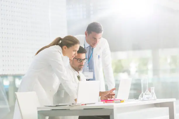 Photo of Doctors using laptop in laboratory