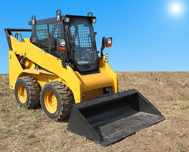 istock The yellow truck with a scraper to lift cargo. 495828758