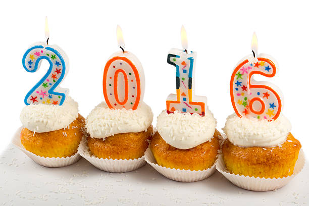 istock Christmas donuts with burning candles on a white background 495829260