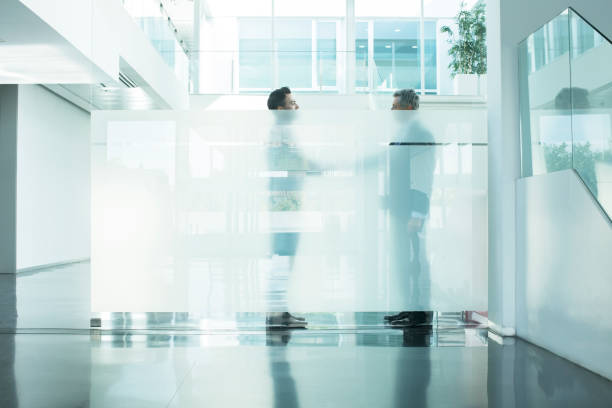 istock Businessmen talking in modern office 495829423