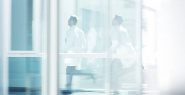 istock Doctors running in hospital corridor 495829731