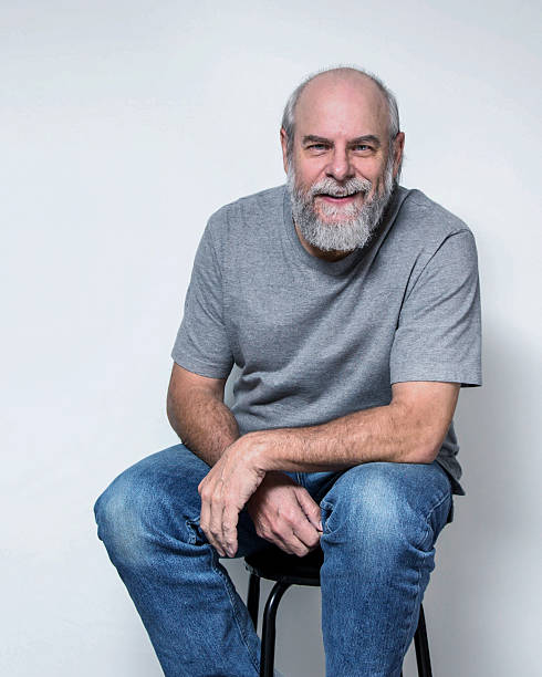 istock Casual Dressed Adult Man Sitting Smiling 495831122