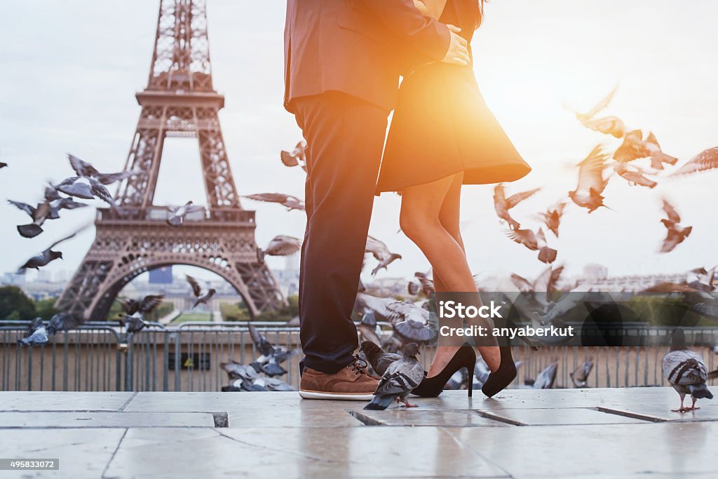 couple near Eiffel tower in Paris couple near Eiffel tower in Paris, romantic kiss Paris - France Stock Photo