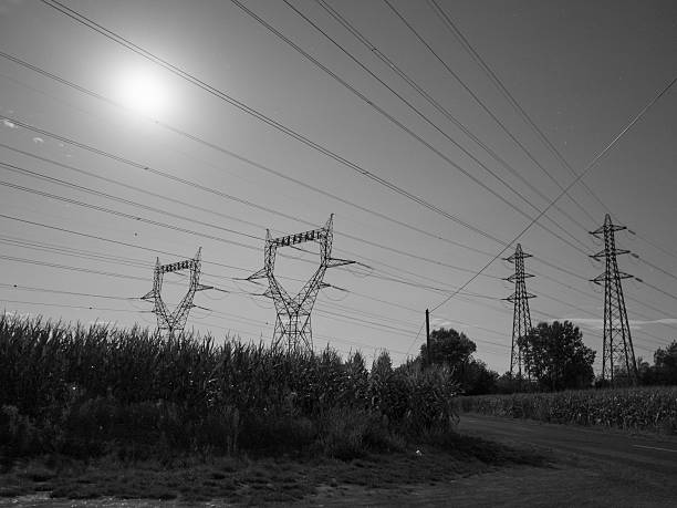 istock Bugey, electricity pylons and full moon 495834186
