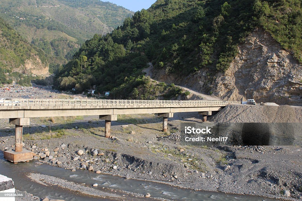 Bridge at Harnui A bridge over the Harnui river, Abbottabad in Pakistan. The river water has gone down to an alarming extent under the bridge. 2015 Stock Photo
