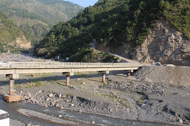 Bridge at Harnui A bridge over the Harnui river, Abbottabad in Pakistan. The river water has gone down to an alarming extent under the bridge. abbottabad stock pictures, royalty-free photos & images