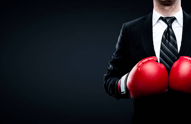 ビジネスマンのボクシンググローブ - knockout ストックフォトと画像