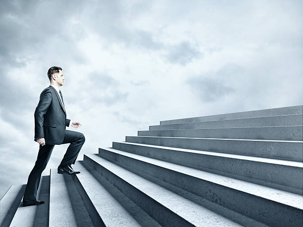 istock businessman climbing to stairs 495836534