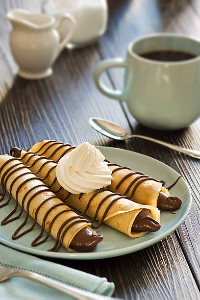 istock Chocolate Hazelnut Spread Crepes with Whipped Cream and Coffee 495840642