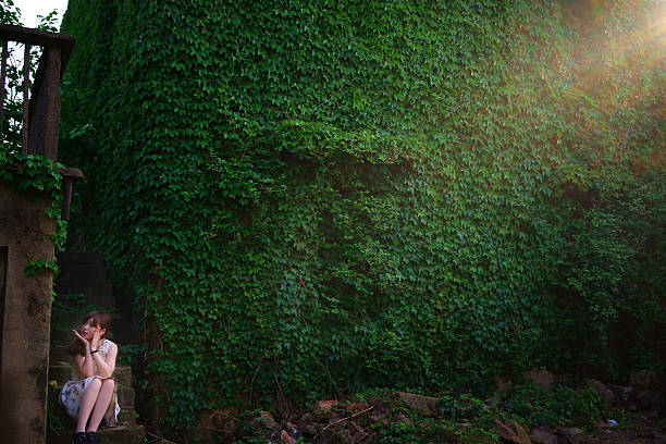 istock Young woman by the wall 495841514