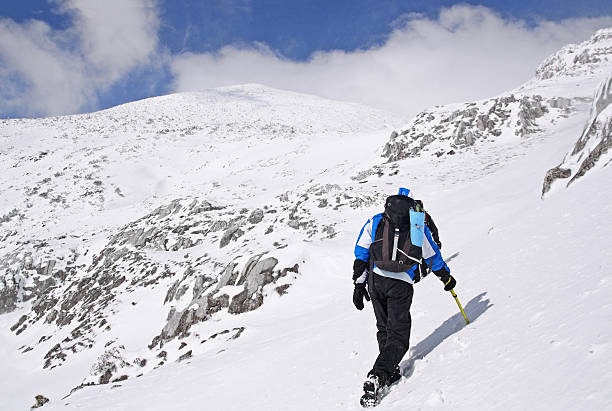 Mountaineer going to the top of a snowy mountain Bjelasnica, Bosnia and Herzegovina