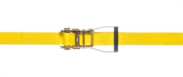 Yellow ratchet strap on a white background Yellow ratchet strap on a white background strap photos stock pictures, royalty-free photos & images